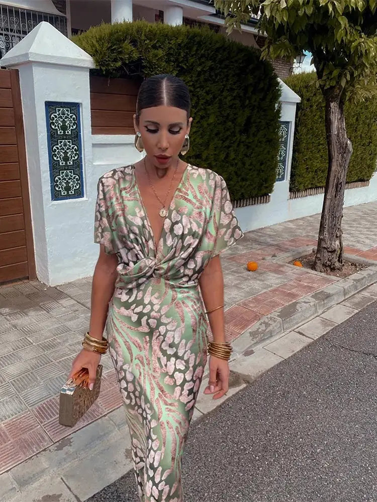 https://cdn.shopify.com/s/files/1/0657/5138/4294/files/Elegant-Printed-Satin-Midi-Dress-For-Women-Chic-V-neck-Short-Sleeve-Pleated-Bodycon-Dresses-Summer_915db6e7-9434-4358-aa39-918b2a4f5211.webp?v=1746095466